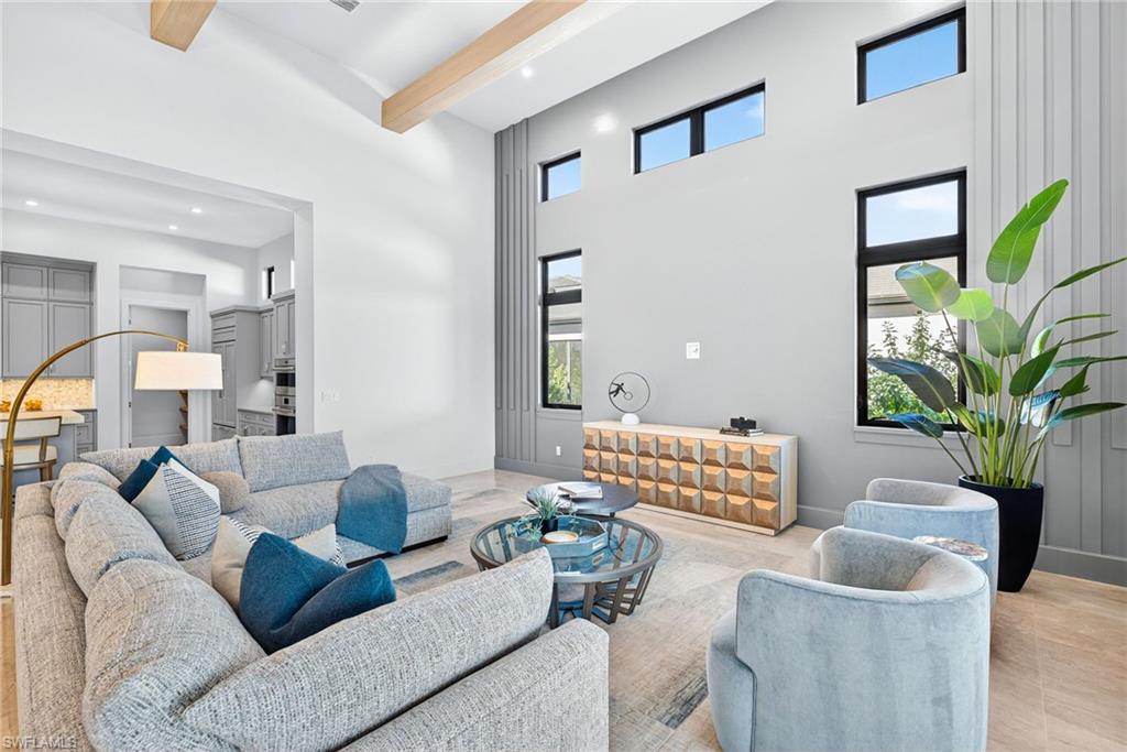 Airy, modern great room,the transom and vertical windows bring in abundant natural light