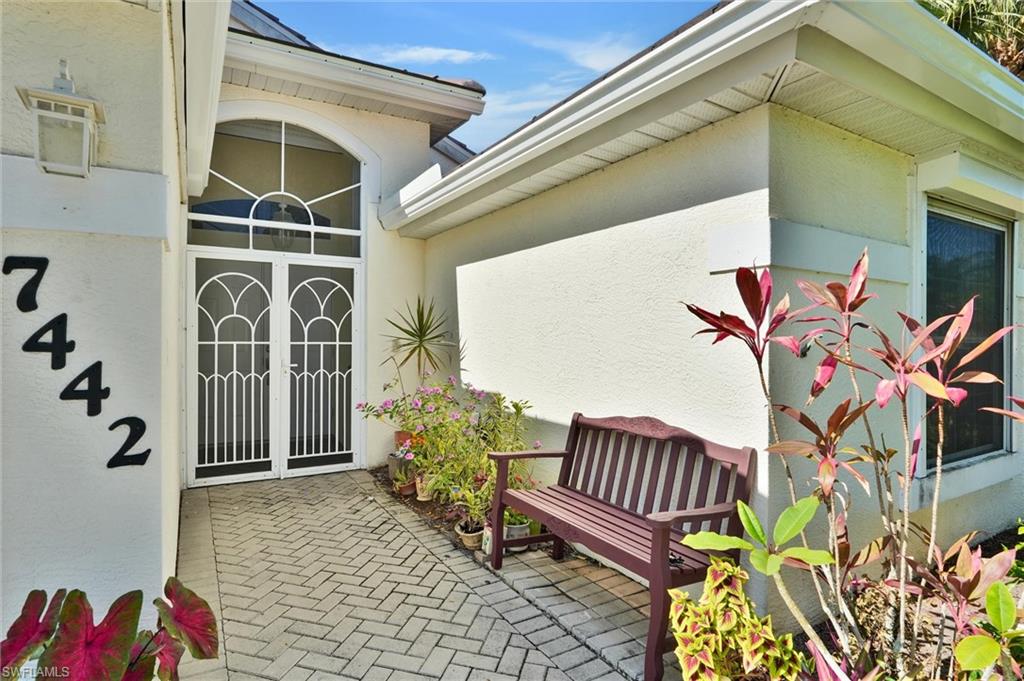 Entryway featuring double security doors with decorative grilles and a transom window