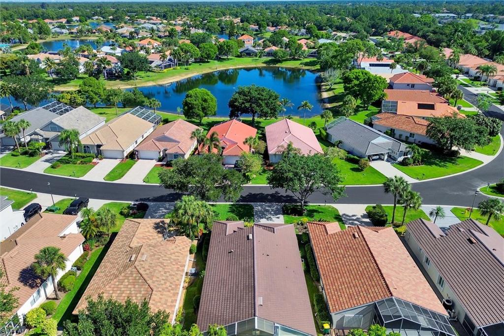 Residential neighborhood featuring a prominent central lake