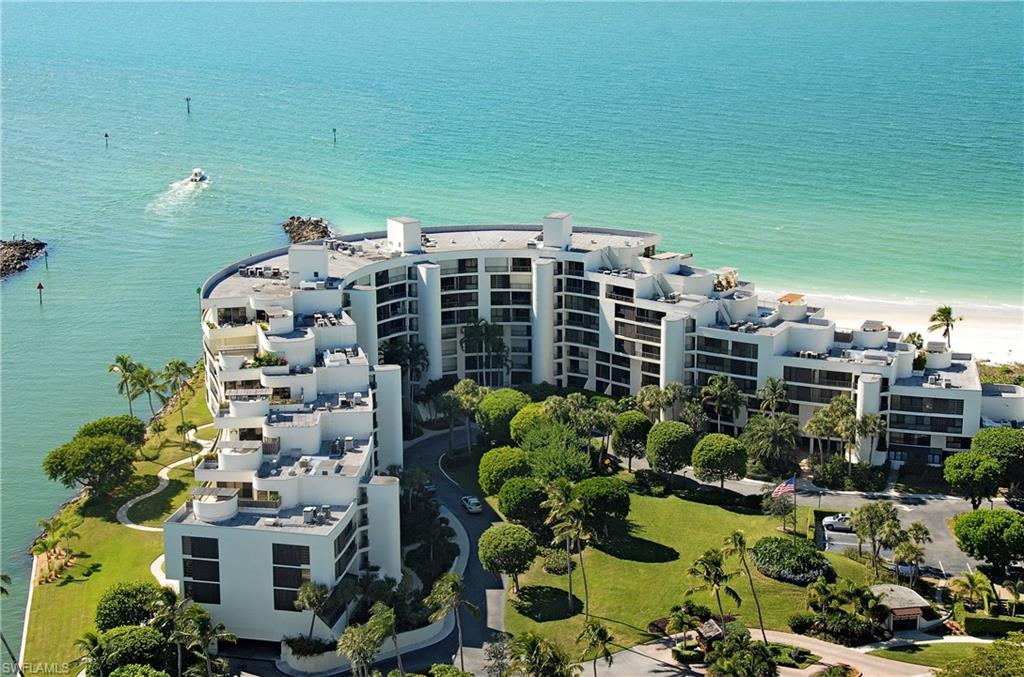 Aerial view of apartment complex / building and a large body of water