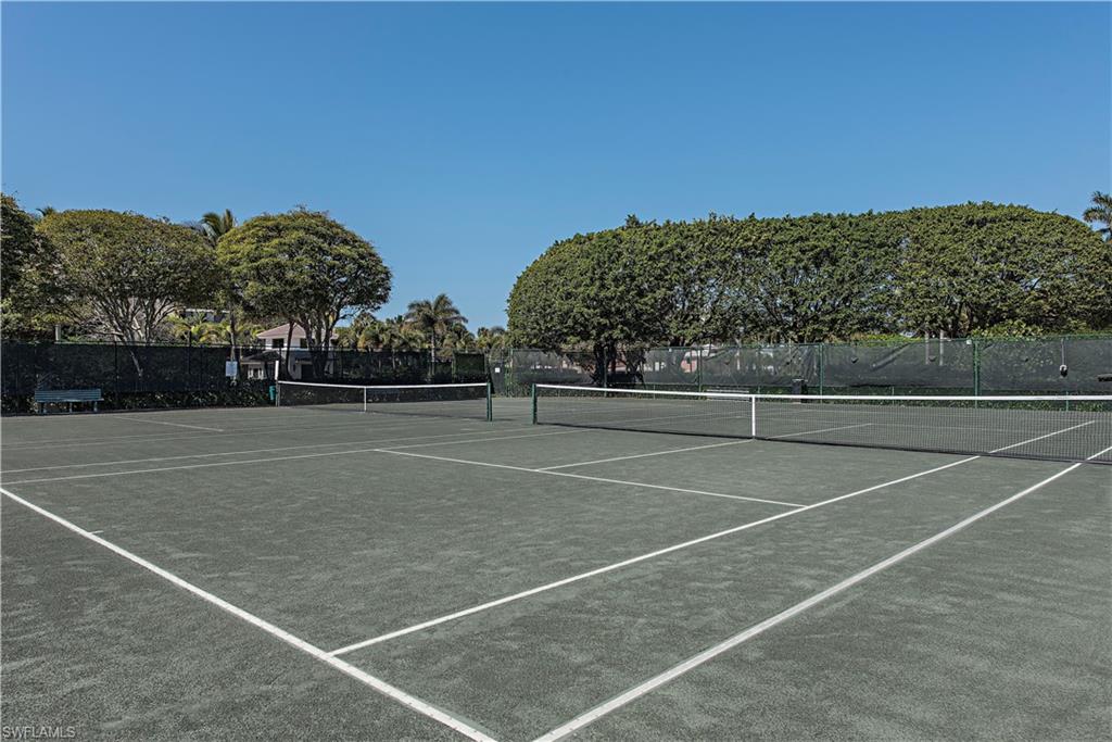 View of tennis court featuring community basketball court