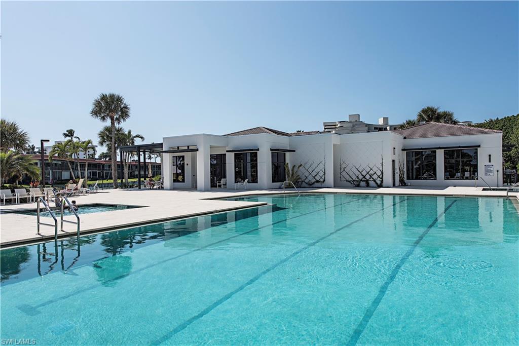 Community pool with a patio