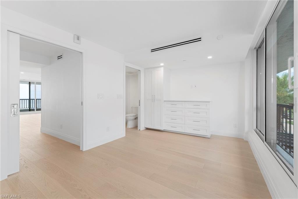Spare room featuring light wood-type flooring and recessed lighting