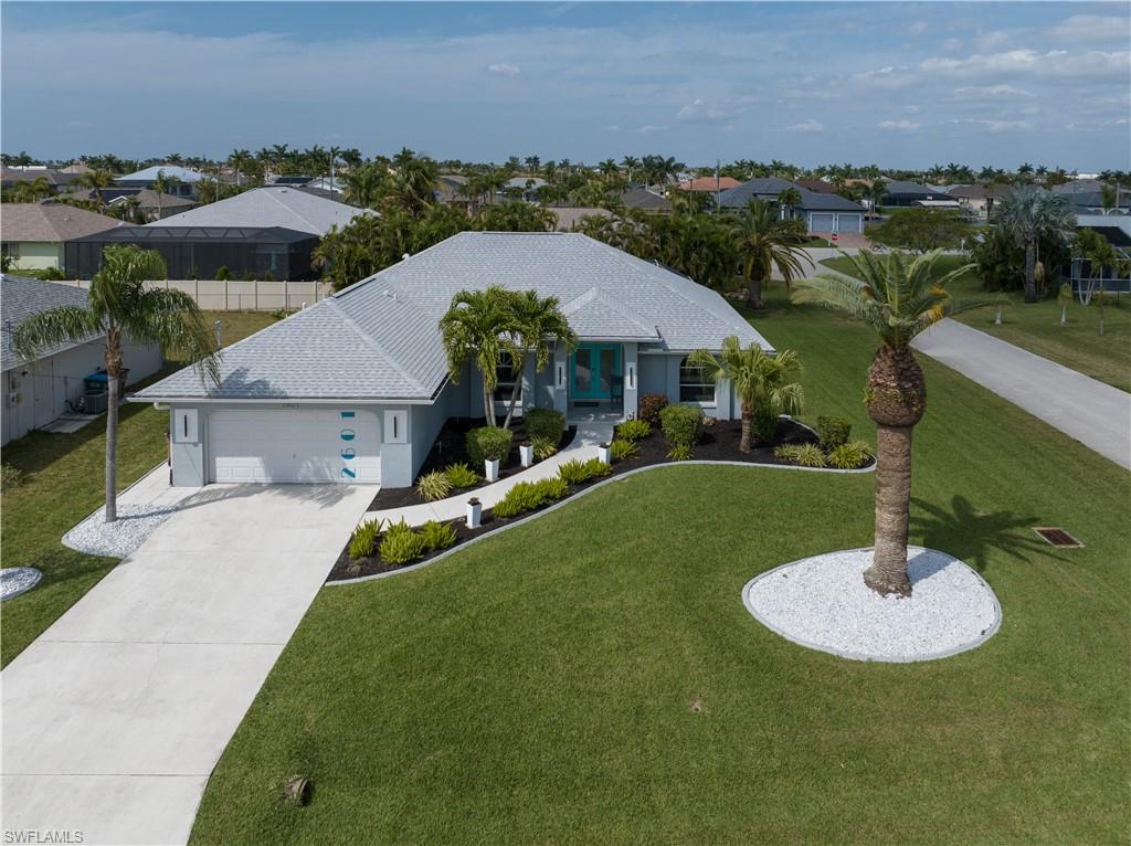 Beautifully landscaped, exqusitely furnished pool home ready for you to live the florida lifestyle