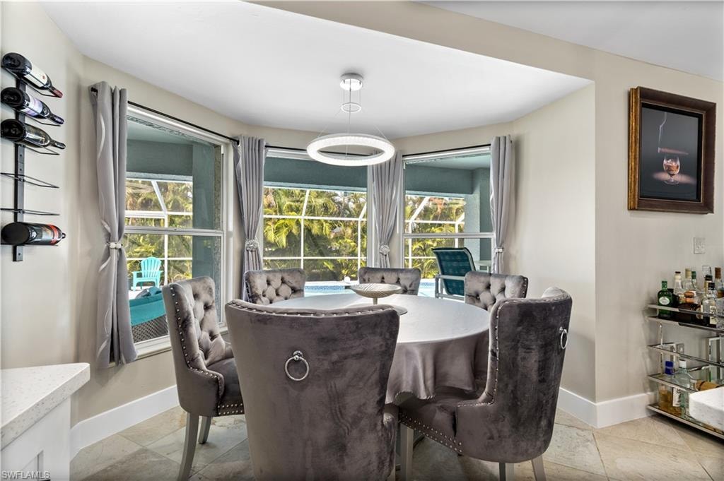 Dining area off of kitchen - overlooking lanai and pool
