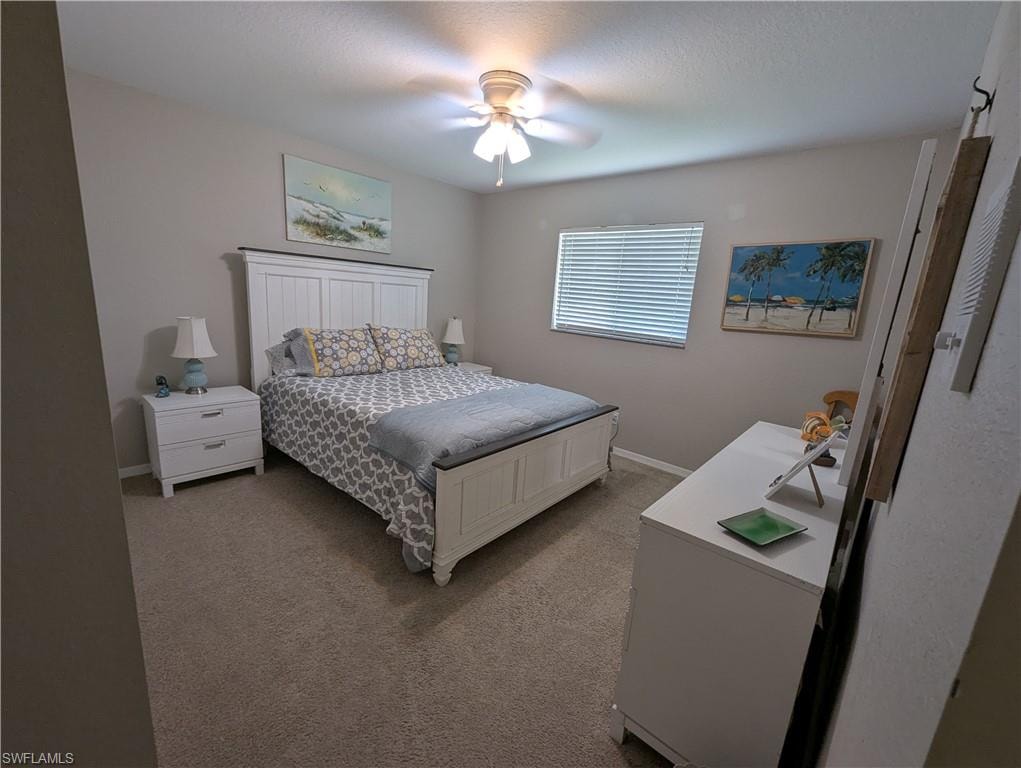 Bedroom featuring carpet and a ceiling fan