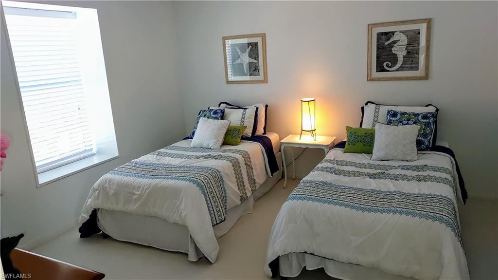 Bedroom featuring multiple windows