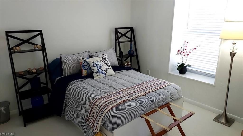 Bedroom featuring baseboards