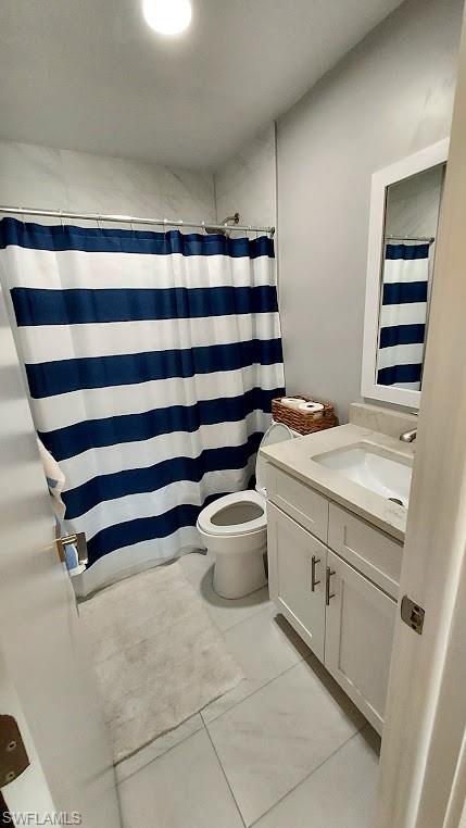 Bathroom with vanity and a shower with shower curtain