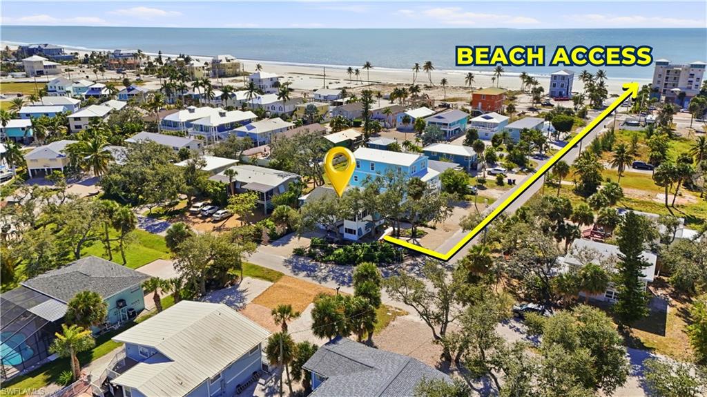 BEACH ACCESS Aerial view of residential area with a large body of water - Virtually Edited Image
