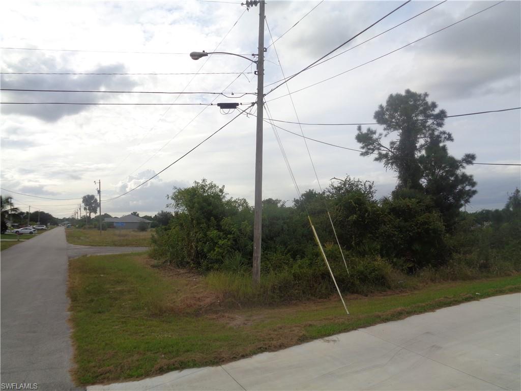 View of asphalt street with street lights