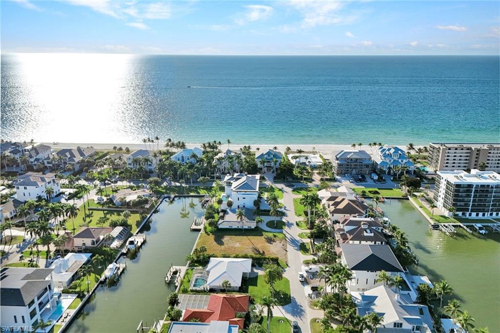 Aerial view of residential area with a large body of water
