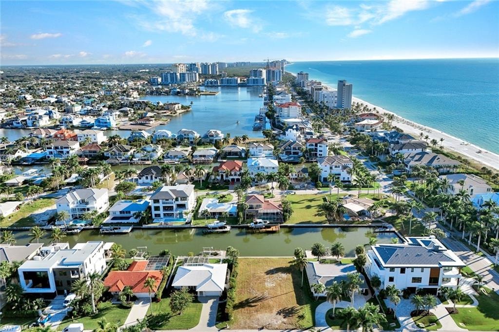 Aerial perspective of suburban area with a large body of water