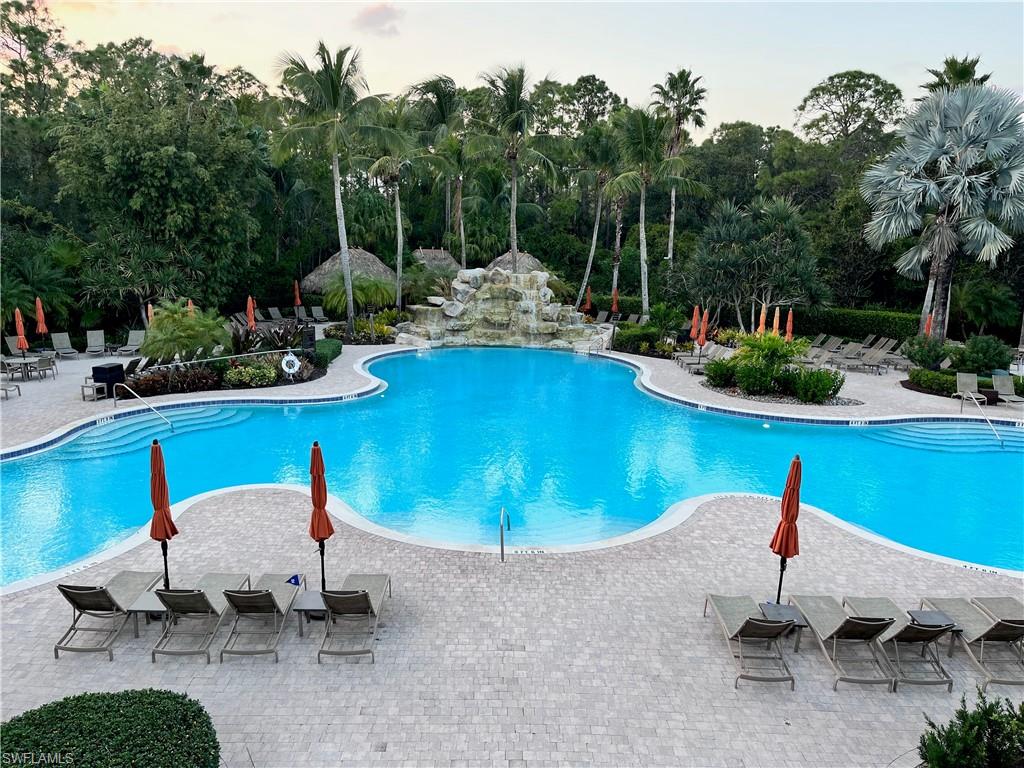 Pool at dusk with a patio