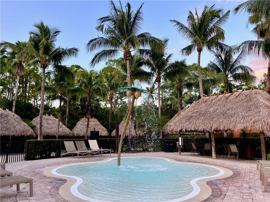 View of pool with a gazebo, a patio, and pool water feature