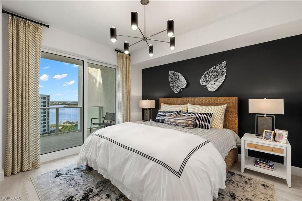Bedroom 1 features a stunning black statement wall, with contemporary decor