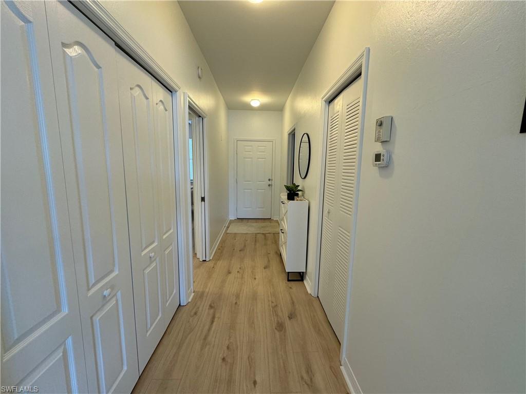 Hall featuring light hardwood / wood-style flooring