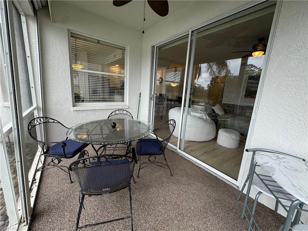 Sunroom / solarium featuring ceiling fan