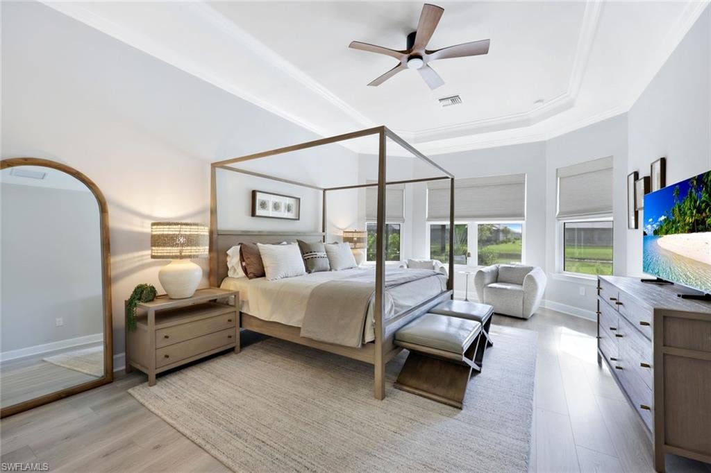 Bedroom featuring a tray ceiling