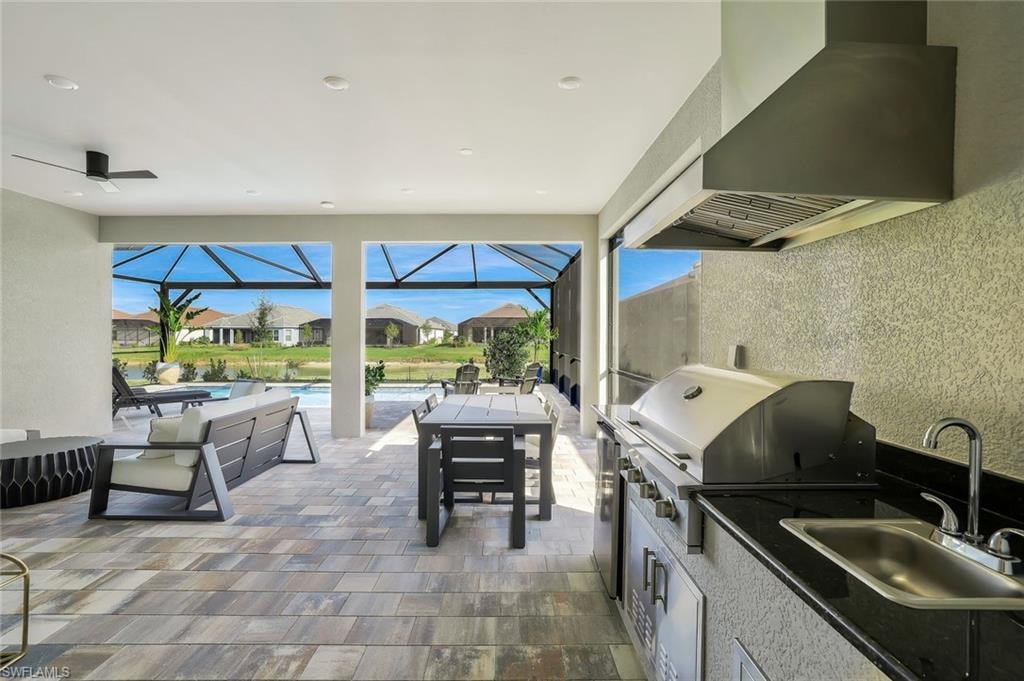 Outdoor pool featuring a sunroom, a lanai, a patio area, a residential view, and a lawn