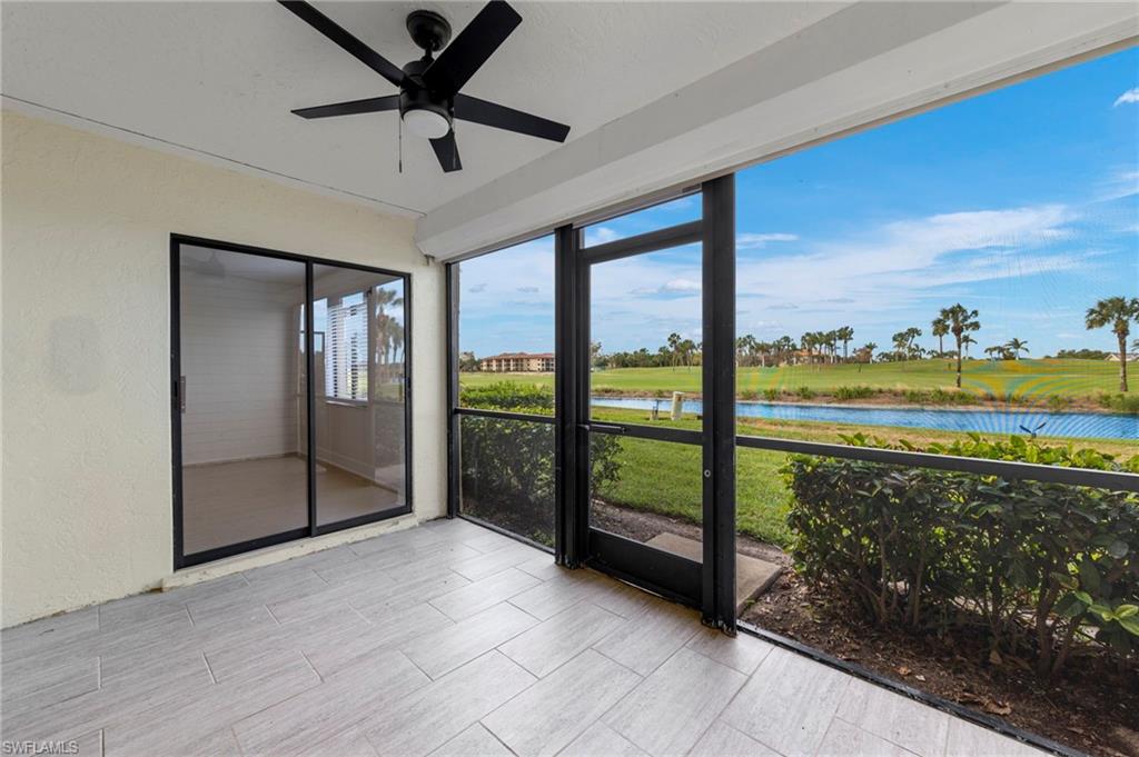 Unfurnished sunroom featuring a water view