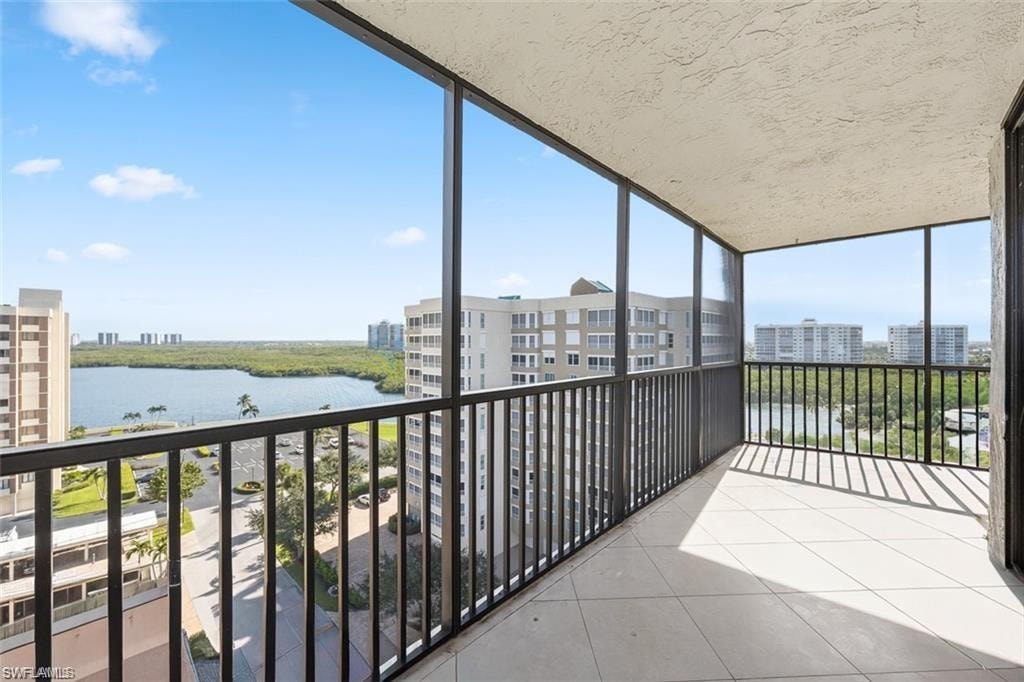 Unfurnished sunroom featuring a water view