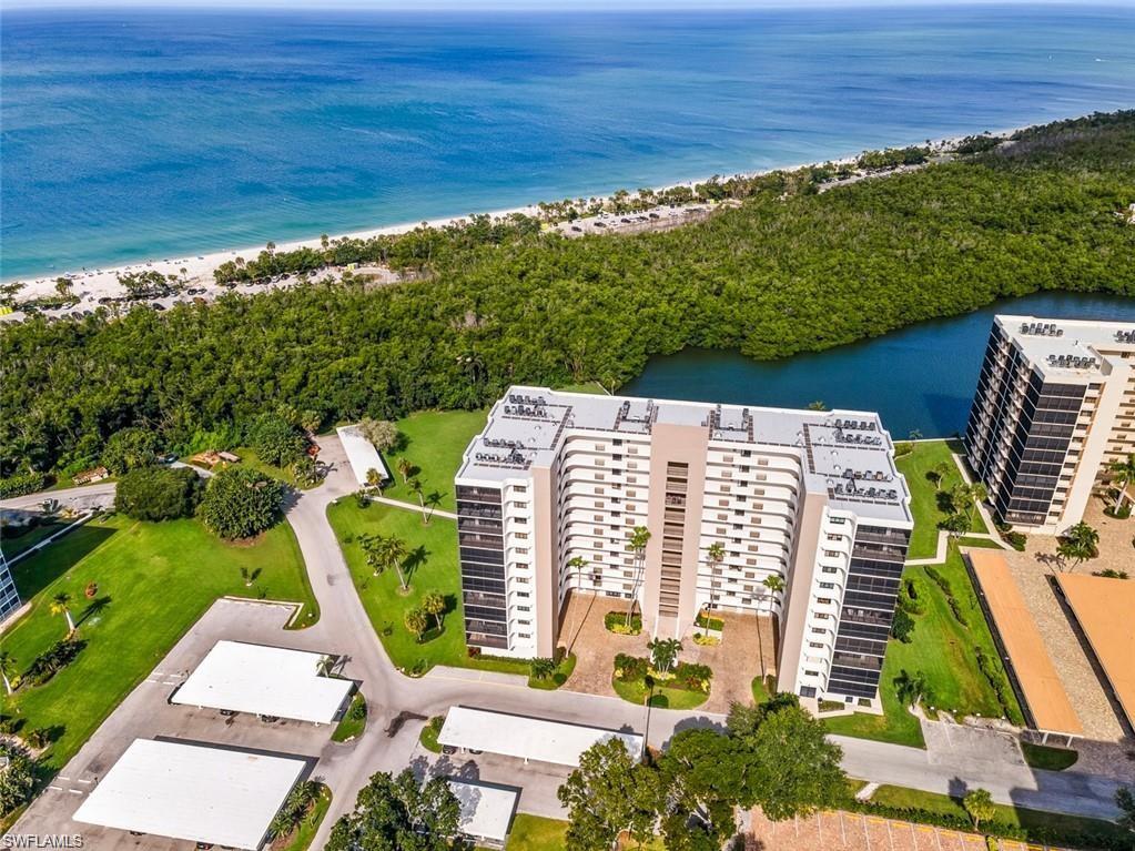 Aerial view of extended coastline and apartment complex / building