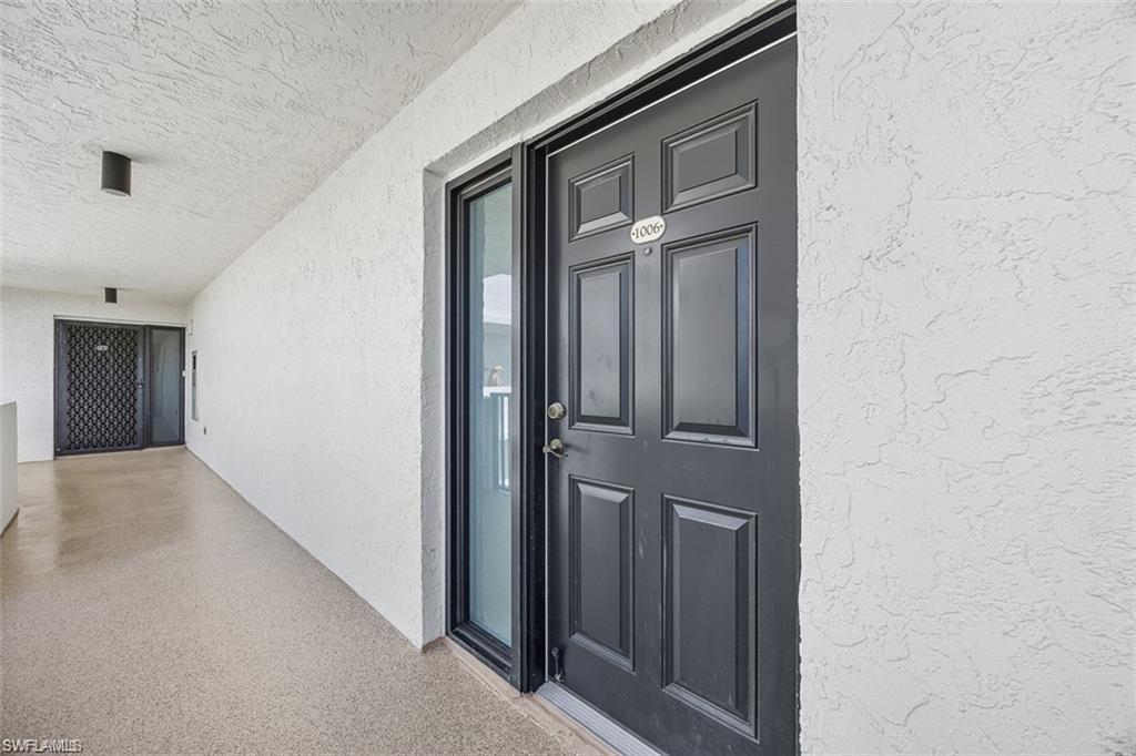 Property entrance with stucco siding