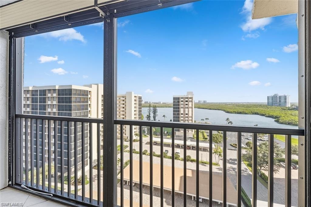 Balcony with a water view and a city view