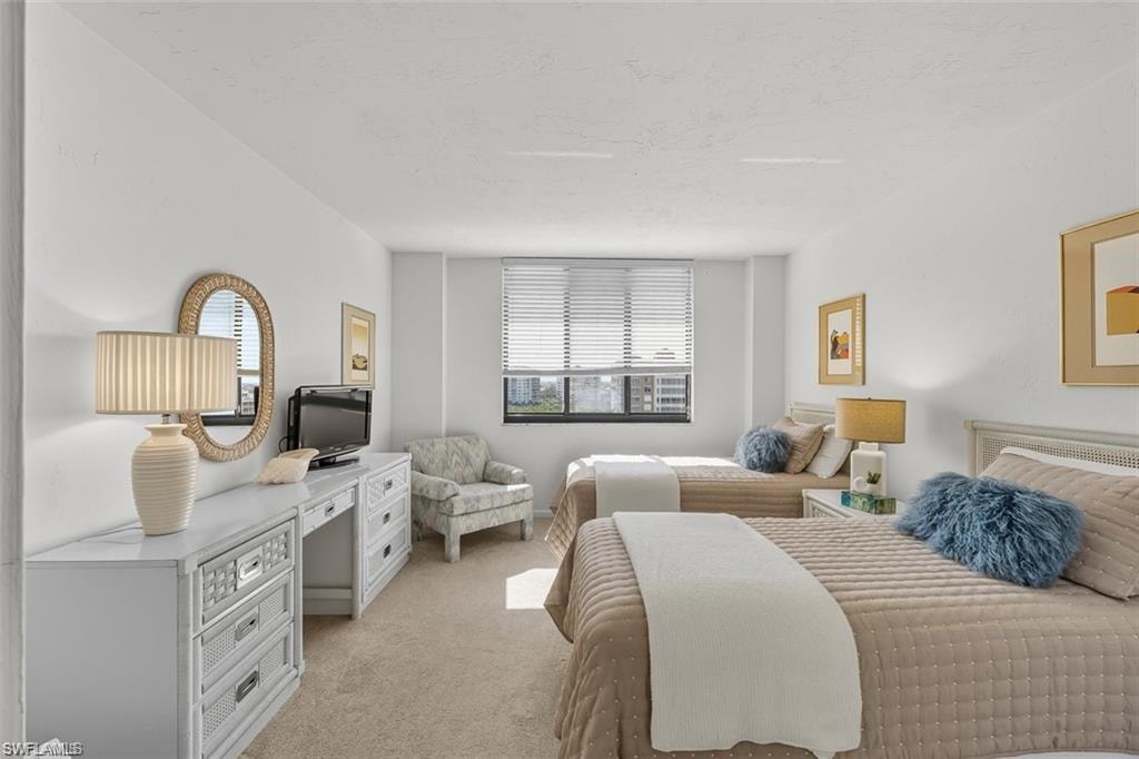 Bedroom with light carpet