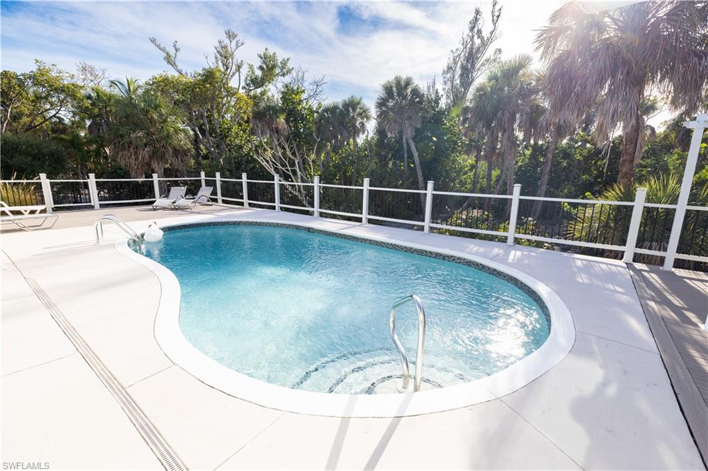 View of swimming pool featuring a fenced backyard and a patio