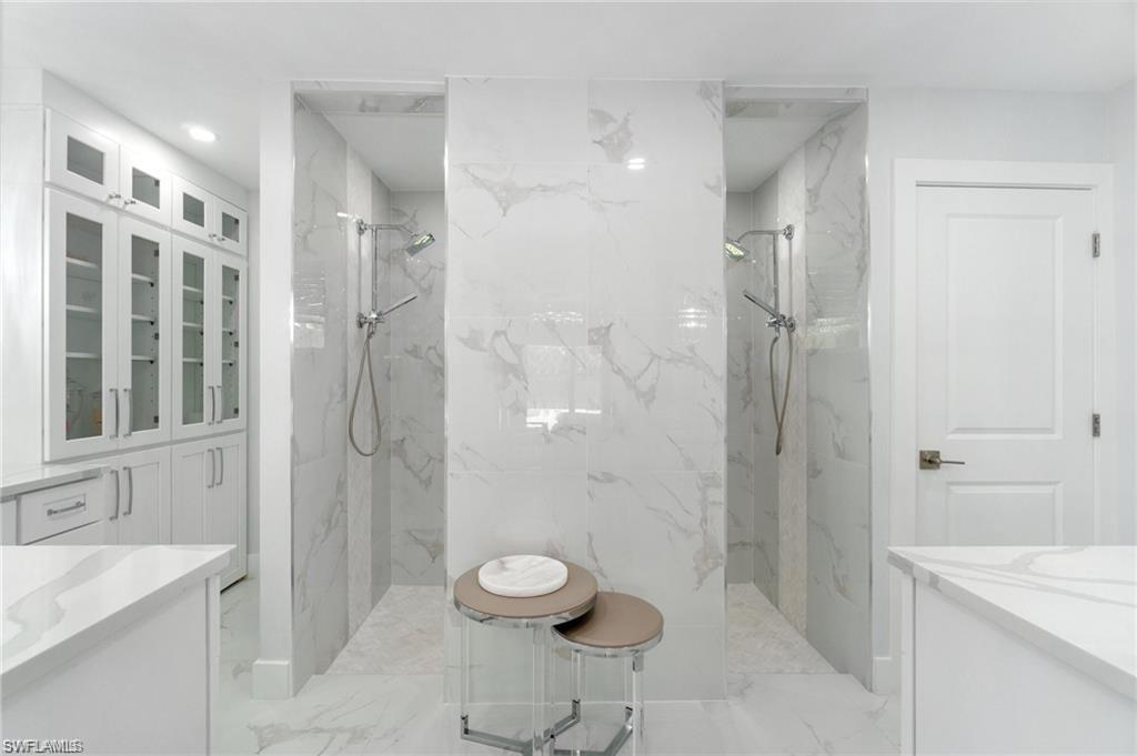 Custom cabinetry, large walk-in shower, separate toilet room with bidet, his and her sinks.