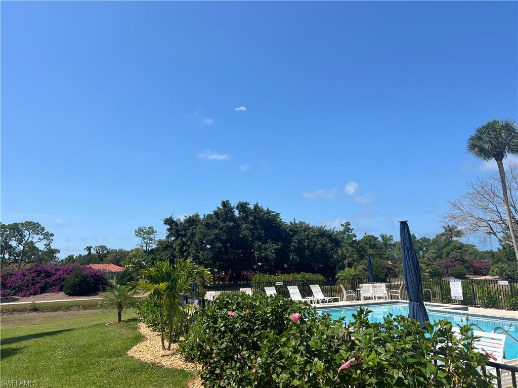 Community pool featuring a patio