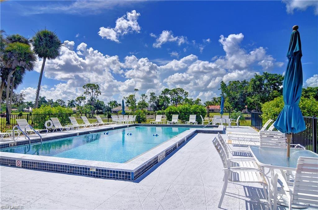 Community pool with a patio