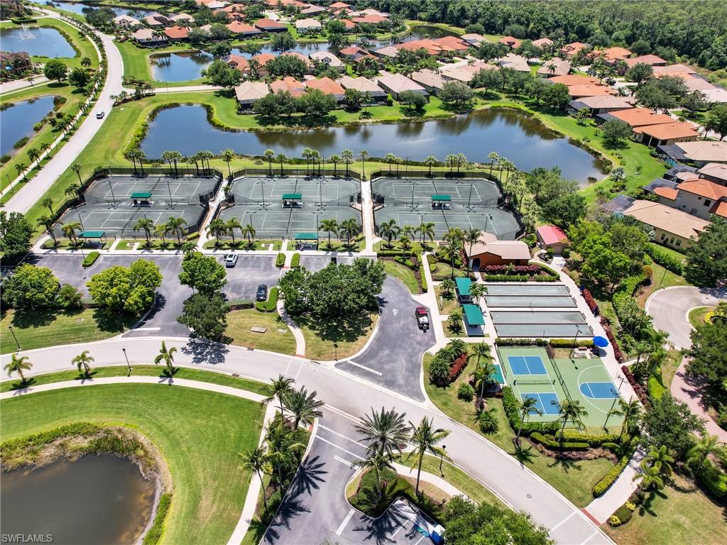 View of property location with a nearby body of water and nearby suburban area