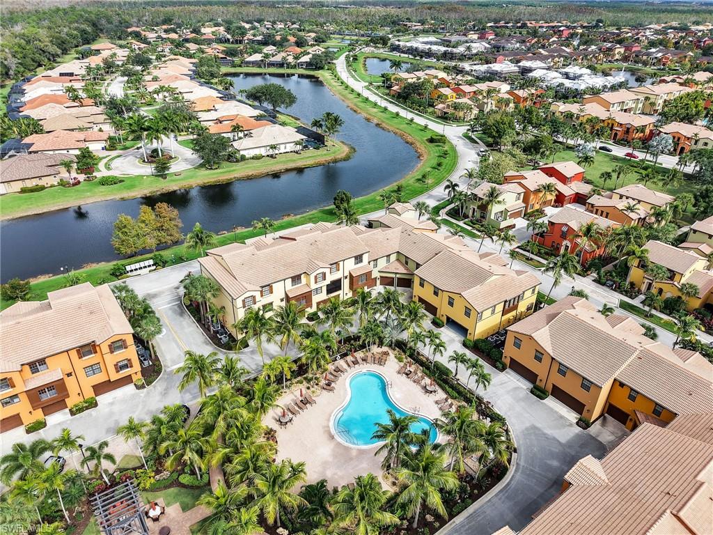 Aerial perspective of suburban area featuring a large body of water
