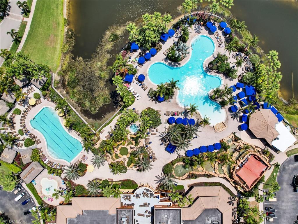 Bird's eye view of a pool area and a large body of water