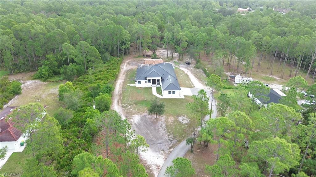 View of property location featuring a heavily wooded area