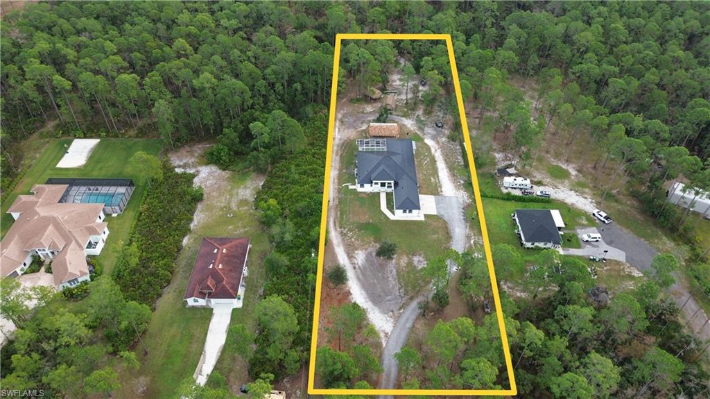 Aerial view of property's location with a forest and property boundaries highlighted