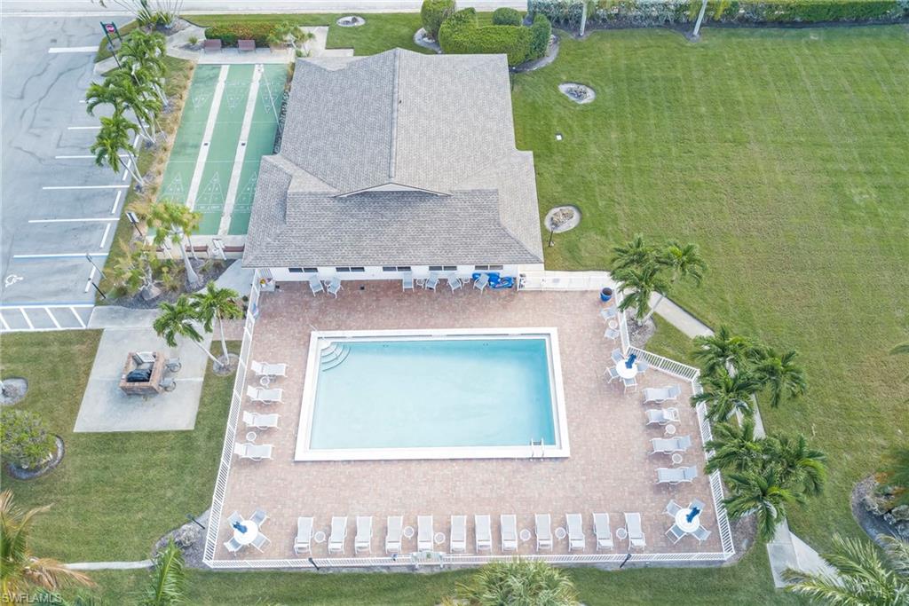 Aerial view of property and surrounding area with a pool area