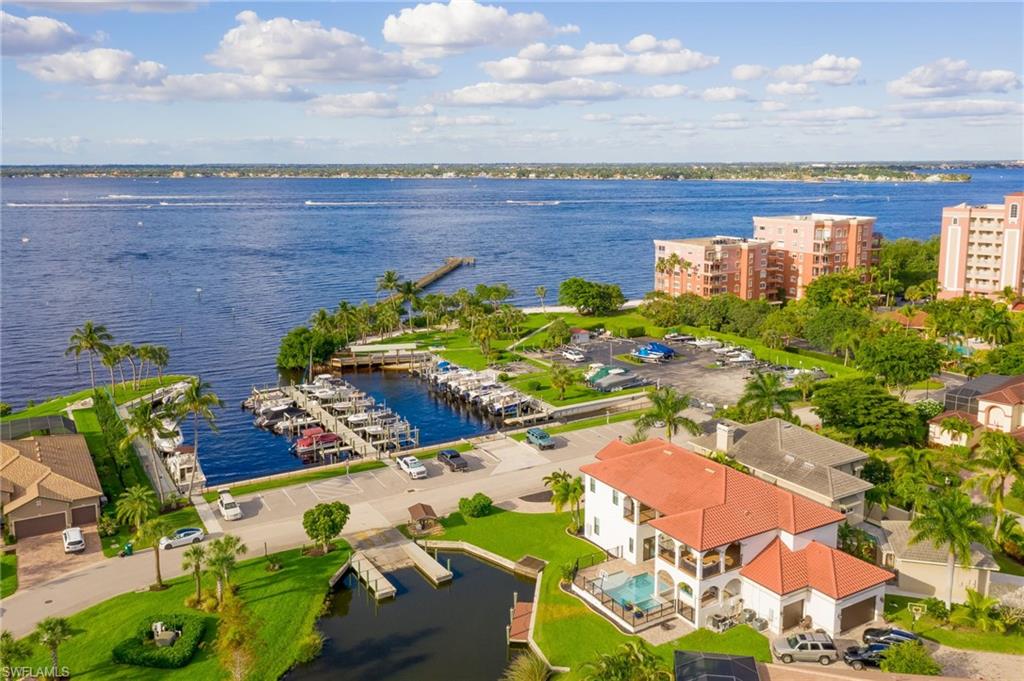 Aerial view of a marina and a nearby body of water