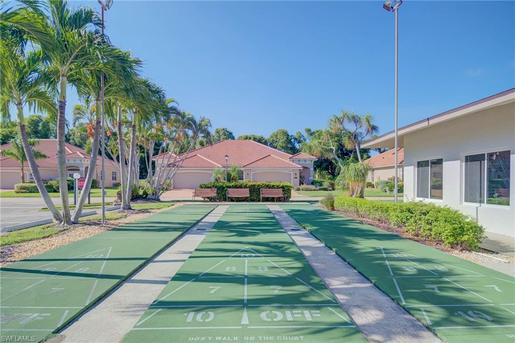 View of property's community with shuffleboard