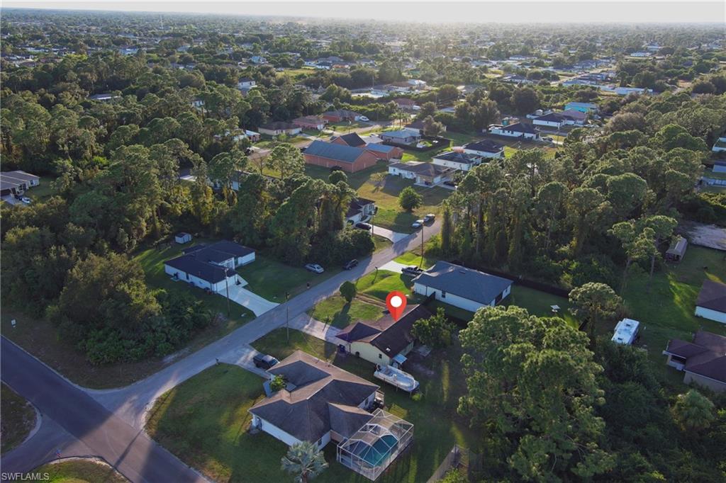 Aerial view of property's location featuring nearby suburban area
