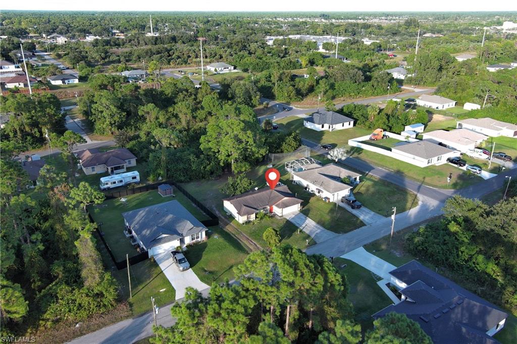 Aerial overview of property's location featuring nearby suburban area