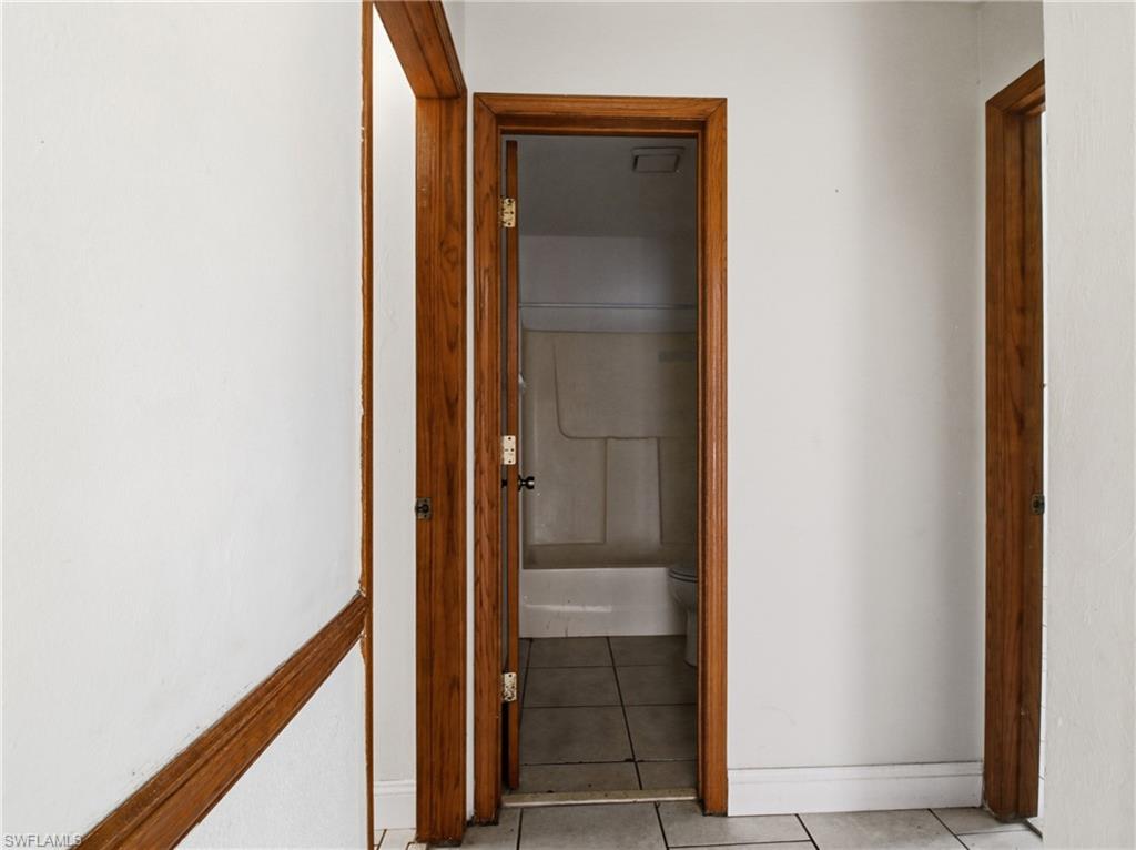 Corridor with tile patterned floors