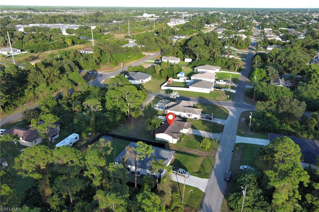 Aerial overview of property's location featuring nearby suburban area