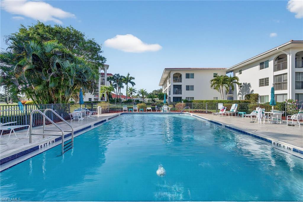 Community pool with a patio