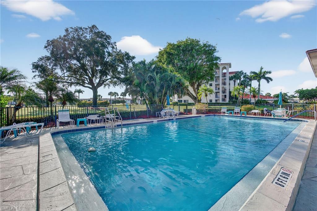 Community pool featuring a patio