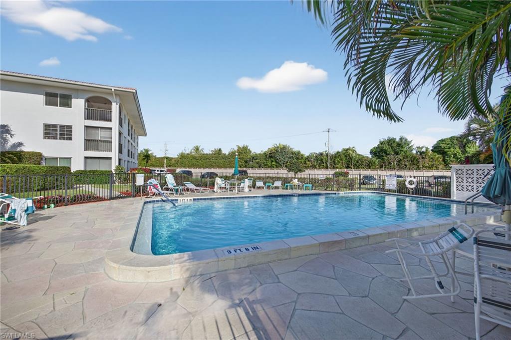 Community pool featuring a patio