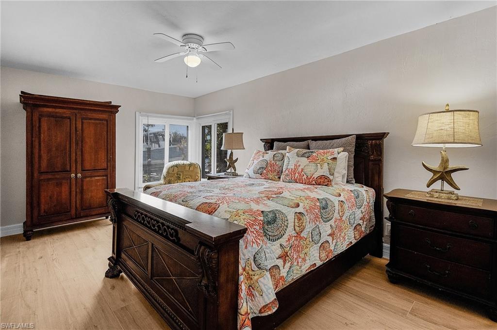 Bedroom featuring light wood-style flooring and a ceiling fan